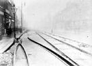 Laying tram tracks, South Street, Moor, No. 196 Burgon and Son, grocers, left, Nos. 211 - 213 Langton and Sons, boot manufacturers and dealers, right