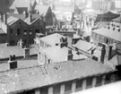 Elevated view of City Centre (looking towards Norfolk Street) from the roof of Central Library. Roof of John Round and Son Ltd, Tudor Works, Tudor Street, foreground, buildings in background include St. Marie's RC Church and Nether Congregational Cha