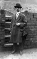 George Arthur Fox (1871 - ), (stage name Professor De Lyle, conjuror) on steps at the back of  No. 184 Ecclesall Road