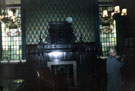 Stained glass windows depicting Cutlers Coat of Arms and showing the 17th century oak fireplace, The Master Cutlers Room, Cutlers Hall, Church Street