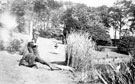 Estate staff from Whirlow House, off Ecclesall Road South, engaged in a mock shooting in the grounds with a stuffed crocodile. Home of Edgar Allen, Steel Manufacturer