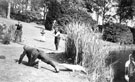 Estate staff from Whirlow House, off Ecclesall Road South, engaged in a mock shooting in the grounds with a stuffed crocodile. Home of Edgar Allen, Steel Manufacturer