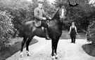 Gardener, horse and rider in the grounds of Whirlow House, off Ecclesall Road South. Home of Edgar Allen, Steel Manufacturer. The horseman was a former jockey