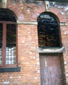 Wall of a Crucible Furnace visible behind the window at Cornish Works, Cornish Street