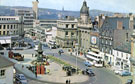 View: v01991 Elevated view of Fitzalan Square, looking towards junctions of Haymarket, High Street and Commercial Street. Buildings include The Bell Hotel and Classic Cinema. Postcard bought June 17th 1965