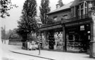 Nether Edge Road showing the Post Office, run by the Holt family and Hubbard's Drapery shop