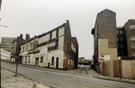 Derelict properties including Mr. George, menswear and Everyman formerly Ellis Pearson and Co. Ltd., Glass Cutting Works, Corporation Street showing the junction with Steelhouse Lane from Spring Street