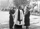 View: v03263 Wing Commander Ken A. Mummery, Rev. Gledhill and Lady Mayoress outside the Cathedral, march by R.A.F. Norton through the City