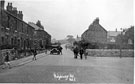 Ridgeway Road at the junction with Hollinshead Road with Church Row Cottages on the left