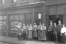 Members of staff outside John Truswell Ltd., provision merchants and pork butchers, No. 69 Allen Street