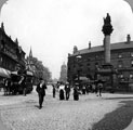 Crimean Monument, Moorhead, showing horse drawn tram. Public Benefit Boot Co., boot dealers and Nelson Hotel on right behind monument. Pinstone Street in background