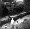 Boys playing in river at Rivelin Valley