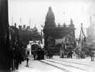 View: y00612 High Street and Fitzalan Square decorated for the royal visit of King Edward VII and Queen Alexandra, Birmingham District and Counties Banking Co. Ltd and Tram 202, centre