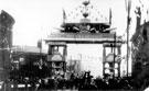 View: y00690 Decorative arch on Savile Street to celebrate the royal visit of King Edward VII and Queen Alexandra, sponsored by John Brown and Co., designed and erected by G.H. Hovey