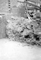 View: y00882 Sheffield Castle excavations recorded by J.B. Himsworth. Newly concreted excavation, burying the plinth of tower and several courses of masonry