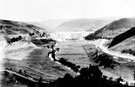 Construction of Howden Dam, Birchinlee village, left. Trestle Gantry Bridge, in foreground, left