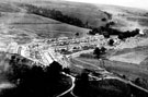 Elevated view of Birchinlee Village, Derwent Valley, showing temporary corrugated iron huts, built by Derwent Valley Water Board, which housed the workers who built the dams