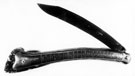 Large clasp knife with horn handle, made by Abraham Brooksbank, Sheffield. On the handle is a metal strip, inscibed at the top 'Whittle Club' and 'Past Master Whittlers'. Below this, there is a series of names