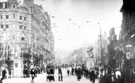 View: y01484 High Street decorated for royal visit of King Edward VII and Queen Alexandra. Marples Hotel, left. Fitzalan Market Hall, right