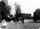 Pinstone Street showing St. Paul C. of E. Church and the construction of Stewart and Stewart, tailors, left