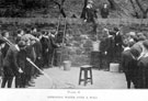 Siphoning water over a wall, part of a series of practical open-air studies in Elementary Science, Nature Study, Drawing and Geometry by Headmaster, J. Eaton Feasey, using pupils from Nethergreen School also known as Ranmoor School)