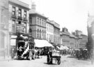 Broomhill horse bus on High Street, from Church Street, prior to road widening and the demolition of former Auction Mart, left. Premises also include Nos 11-15, Goldsmith's Chambers (with blinds)