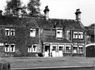 Travellers' Inn, No. 72 Penistone Road North. A coaching inn, believed that the exterior has not been greatly changed for many years except for removal of horse troughs. Large fireplace in kitchen bears inscription, 1697.