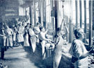 View: y03639 Mappin and Webb Ltd., silversmiths, Royal Works, Norfolk Street, stampers at work