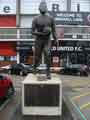 View: a01497 Sculpture of Joseph ''Joe'' Shaw (1928-2007), Sheffield United footballer, in car park of Sheffield United FC on junction of Bramall Lane and Cherry Street