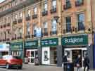 View: a03526 Shops on Pinstone Street showing (r. to l.) Nos. 30 - 34 Budgens Supermarket and No. 36 Johnsons Dry Cleaners UK Ltd