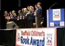 View: a03569 Ellie Crisell (first left) with children at the Sheffield Children's Book Award