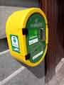 View: a04250 Defibrillator on the wall of the Banker's Draft public house, Market Place (Castle Square)