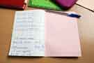 View: arc01577 Student's notebook on a desk during Mandarin class at Sheffield Chinese School, Sheffield