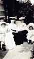 View: arc02544 Edith Wightman (1850 - 1943) and her sister Mary Agnes Swift (1848 - 1936) and two young children outside Lady Bower House, c. 1908