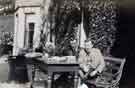 View: arc02546 Benjamin Arthur Wightman (1873 - 1937) with another gentleman, possibly his uncle Henry Temple Wightman (1866 - 1920) [Arthur Wightman's youngest brother], sitting on a bench at a table outside Lady Bower House