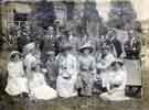 View: arc02573 Wightman family and friends group of 14 individuals in unknown garden setting, c. 1910