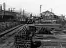 View: arc02857 Metal stacked at Tinsley Rolling Mills, c. 1950s