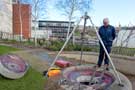 View: c04184 Workmen repairing water feature, Sheffield Hallam University