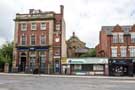 View: c04562 Nos.747-49, Royal Bank of Scotland; 751, former W. Pierrepont, green grocers; 755, and Natlin IT Solutions, with Christ Church Sunday School in the background