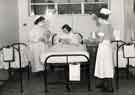 View: h00106 New mother with twins in cubicle on maternity ward, City General Hospital / Fir Vale Infirmary (latterly Northern General Hospital), Fir Vale c.1950s