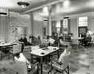 Dining room with patients and nurses at unidentified hospital, c. 1950s