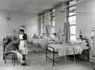 View: h00170 Ward 22, City General Hospital / Fir Vale Infirmary (latterly Northern General Hospital), Fir Vale showing (left) Sister Wadd SRN, gold medallist student in 1953 talking to students