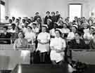 View: h00233 Nurses, some in District Nurses uniforms, possibly at Nether Edge Hospital for lecture/talk