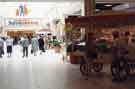 View: s31387 Market Street Food Hall looking into Sainsbury's Savacentre, Lower Mall, Meadowhall Shopping Centre, Meadowhall showing Cookie Jar street barrow