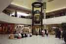 View: s31388 Market Street area, Lower Mall, Meadowhall Shopping Centre, Meadowhall showing Crucible Teemers sculpture on the right and customer lift in the centre of the photograph