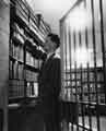 View: s31834 Michael Hudson, Local Studies Librarian, outside Strong Room No.1, Central Library, Surrey Street