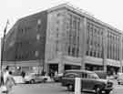 View: s33452 John Walsh Ltd, department store (latterly Rackhams, House of Fraser and T.J.Hughes), junction of High Street and Arundel Gate with Park Hill flats in the background