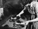 Etching being applied to a silver nickel teapot, before being silver plated, Walker and Hall Ltd, Electro Works, junction of Howard Street and Eyre Street 