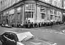 View: s34295 Queue for jobs at the Job Centre, (formerly Barclays Bank), Telephone Buildings, as seen from the corner of Pinfold Street and Holly Street 