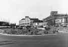 View: s34653 Construction of Sheaf Square roundabout looking towards Arthur Davy and Sons Ltd., provision merchants, Paternoster Row (right) and Kenning Motor Group showroom, Leadmill Road (centre)